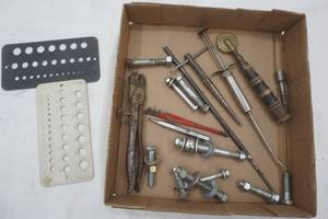 lot 3 image: Antique veterinary syringe, bolts and vintage boring bit and clamp