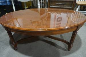 lot 88 image: oval wood coffee table. nice shape. 43.5x 30