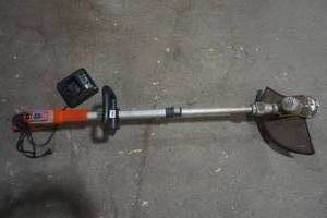 lot 91 image: Black and Decker Power Command Weed Whip with charging block. no battery.