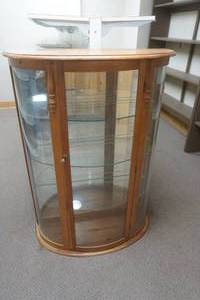 lot 109 image: glass half round hutch. glass shelving, mirrored back. 34.5x18x48