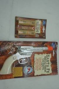 lot 157 image: Cap gun and caps. NEW IN PACKAGE