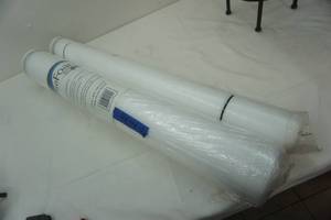 lot 290 image: 2 rolls of foam. new one is 100 sq ft
