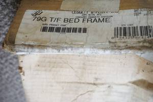 lot 291 image: bed frame. size unknown. possibly a king. 79