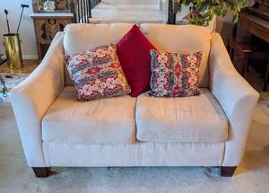 lot 75 image: Beige Ashley Furniture Loveseat