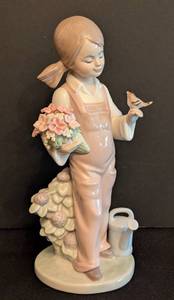 lot 59 image: Lladro Spring Porcelain Girl with Bird Figurine