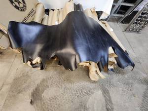 lot 6 image: Raw, Black leather hides