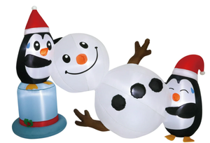 lot 554 image: Holiday Time Christmas Penguins Building a Snowman Inflatable 78W x 48H
