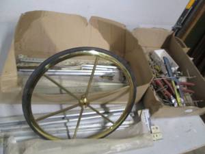 lot 25 image: Drawer slides, a new wheel, tools a...