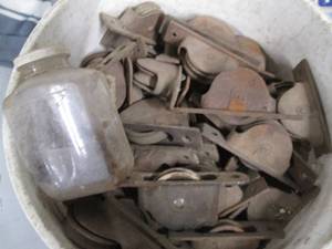 lot 92 image: 5 Gallon bucket of pulleys form cou...