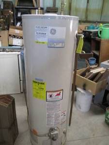 lot 97 image: GE Natural gas water heater, worked...