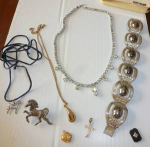 lot 7 image: Sterling silver bracelet with what looks like obsidian, tiger eye necklace, rhinestone necklace etc
