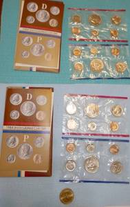 lot 26 image: Two 1984 Uncirculated Coin sets and a Thomas Jefferson Dollar