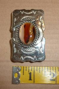 lot 37 image: Two stone belt buckles and One collector buckle with longtime CBS reporter Eric Sevareid