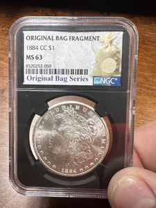1884 Carson City in MS63 Morgan Silver Dollar in a bag frag collector NGC slab
