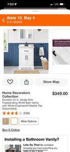 lot 3 image: Home Decorators Collection Doveton 24 in. Single Sink Freestanding White Bath Vanity with White Engineered Marble Top (Marble Top is Broken, but the base is intact