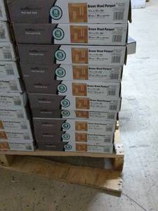 lot 104 image: Lot of 10 Boxes of Brown Wood Parquet Peel and Stick Tiles - 12 x 12