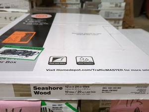 lot 118 image: TrafficMASTER Seashore Wood Peel and Stick Vinyl Plank Flooring - 12 x 24 inches