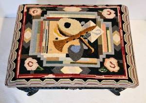 lot 34 image: Antique Black Cast Iron Footstool w Handcrafted Needlepoint 