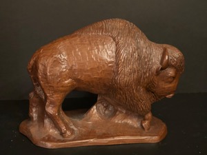 lot 84 image: Rustic Wood Buffalo Sculpture Statue Crushed Pecan Resin Wild West Sculpture