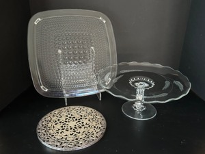 lot 179 image: Lets Make a Cake Two Cake Plates & A Silver Filigree Trivet