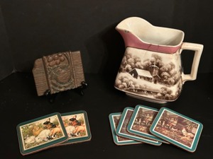 lot 121 image: Antique Decorative Ware Including AMERICAN POTTERS Transferware Pitcher, an Architectural Wood Piece & Coasters