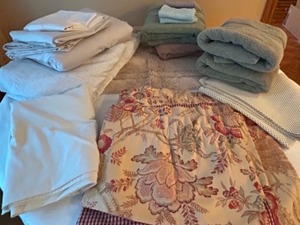 lot 259 image: Huge Lot of Linens Towels, Sheets, Curtains, Undermat & A Rug