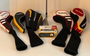 lot 304 image: TAYLORMADE Lot of Collectible Items Including A Rescue Driver Golf Club, Club Covers & Golf Balls