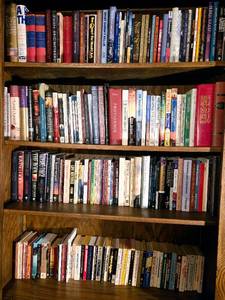lot 329 image: Four Shelves of Diverse and Collectible Books