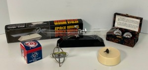 lot 372 image: TOYS with Momentum & Velocity Including a Gyroscope, Space Wheel, Perpetual Motion Top & Baoding Balls