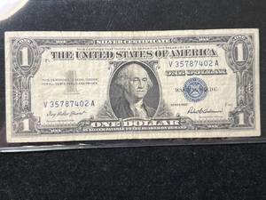 lot 76 image: 1957 US BLUE SEAL $1 SILVER CERTIFICATE
