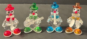 lot 147 image: Set of Four Crystal Clown Musical Figurines
