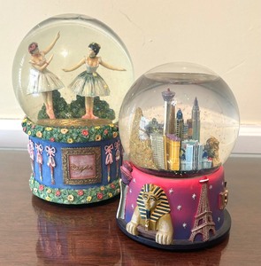 lot 160 image: Two Whimsical Snow Globes including a Las Vegas Snow Globe