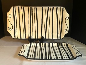 lot 258 image: Two Black and White Caleca Serving Platters