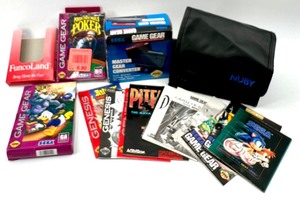 Lot of SEGA GENESIS Miscellaneous items including game case, SEGA GAME GEAR Master Gear Converter &amp More