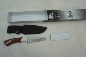 lot 36 image: Ridge Runner. 4.5 fixed blade and sheath. Nice knife. heavy.