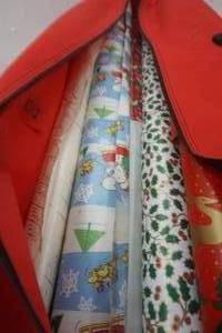 lot 98 image: wrapping paper in tree bag. Full. mostly Christmas paper.