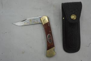 lot 168 image: Ka-bar advertising knife in leather sheaf
