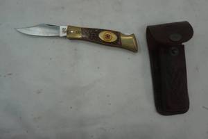 lot 169 image: Camillus #11 pocket knife in leather sheaf