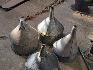 lot 44 image: Lot of (4) Assorted Large Metal Funnels