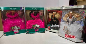lot 114 image: Lot of 4 Boxed Holiday Barbies
