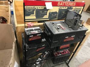 lot 70 image: BATTERY DISPLAY RACK AND DISPLAY BATTERIES