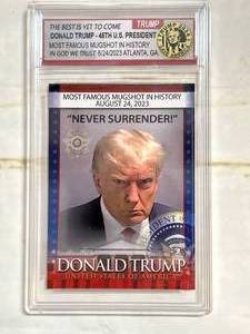lot 76 image: Donald Trump mugshot Trading Cards