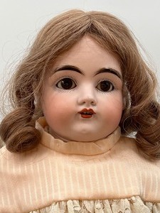 lot 306 image: Antique Bisque Doll - S. Dep. 154 - Light Pink Dress