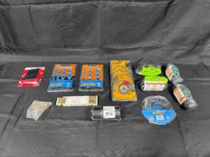 lot 216 image: Mixed Lot of Tools and Accessories Including Saw Blades, Drill Bits, and Fasteners
