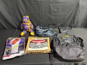 lot 143 image: Assorted Lot Hail Caesar Costume, Power Tools T-Shirt, Plush Teddy Bear, Bags