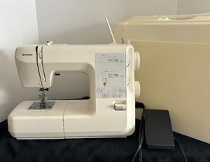 lot 201 image: Kenmore 385.7626890 Sewing Machine