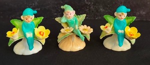 lot 328 image: Set of Three Vintage 1960s Hard Plastic Cake Topper  Decoration  Toy Elf on Leaves with Flowers