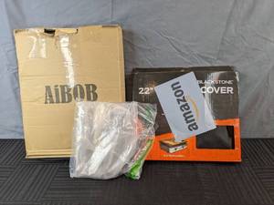 lot 238 image: New 22 Blackstone Griddle Cover, Set of 6 Tongs, and 36 Black Grill Mat