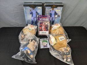 lot 319 image: 8 New Assorted Plushes and Figurines - Wakanda Forever, Genshin Impact, Wednesday, Star Trek, Justice League