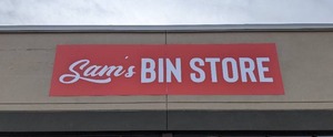 lot 3 image: Sams BIN STORE Aluminum Store Sign 16 x 4